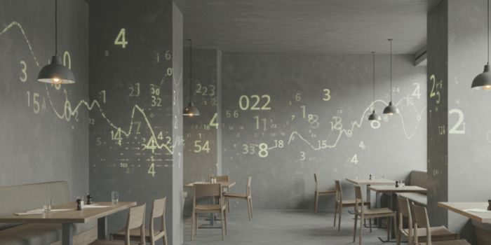 飲食店の内装にグラフや数字が重なったイメージ図